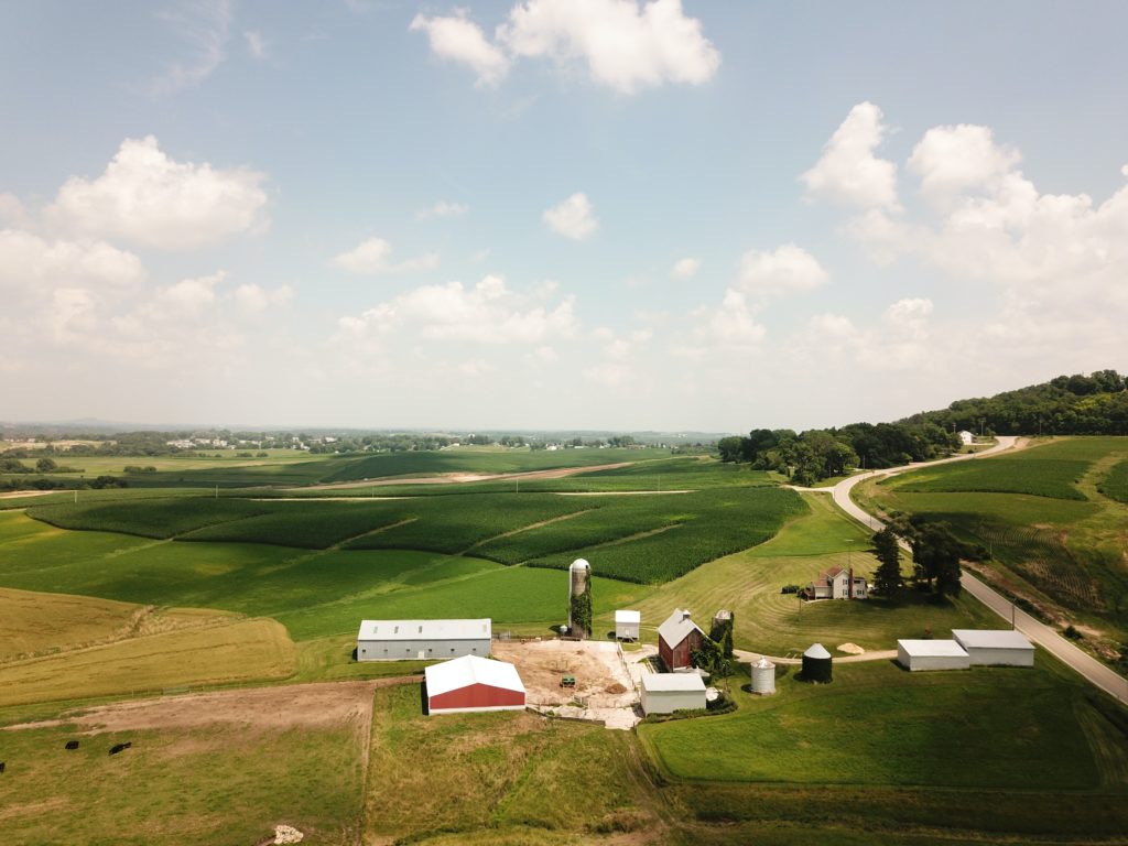 rolling hills with farm, showing a rural area