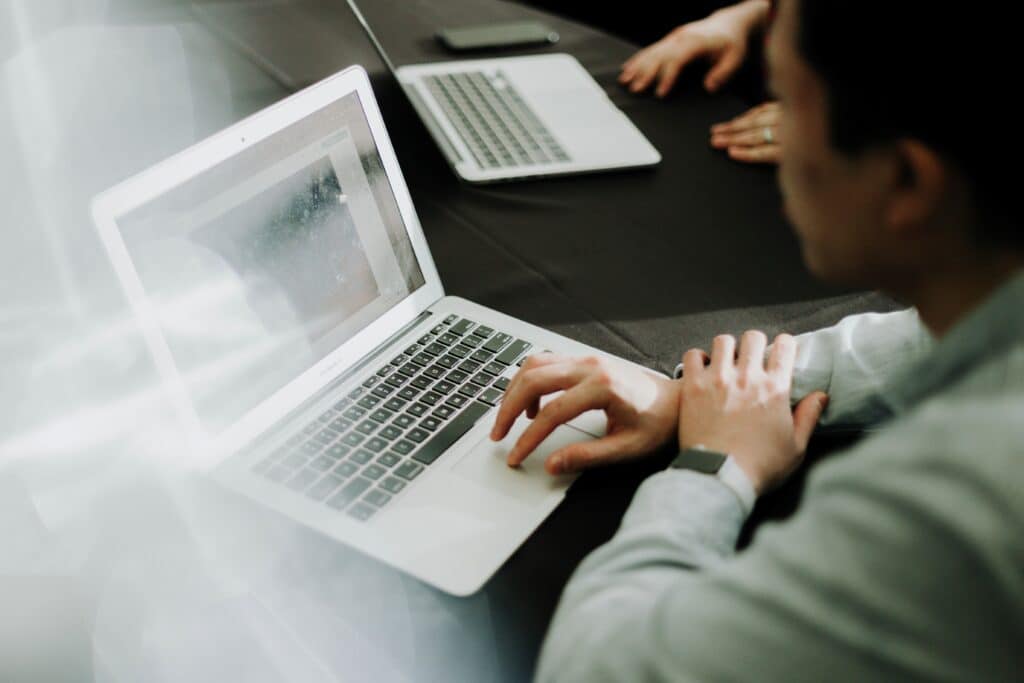 a man on a computer with the left side blurry 2