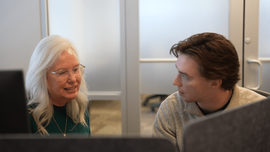 Employee spotlight: Cece Bigner guiding a coworker through CostQuest's modeling process.